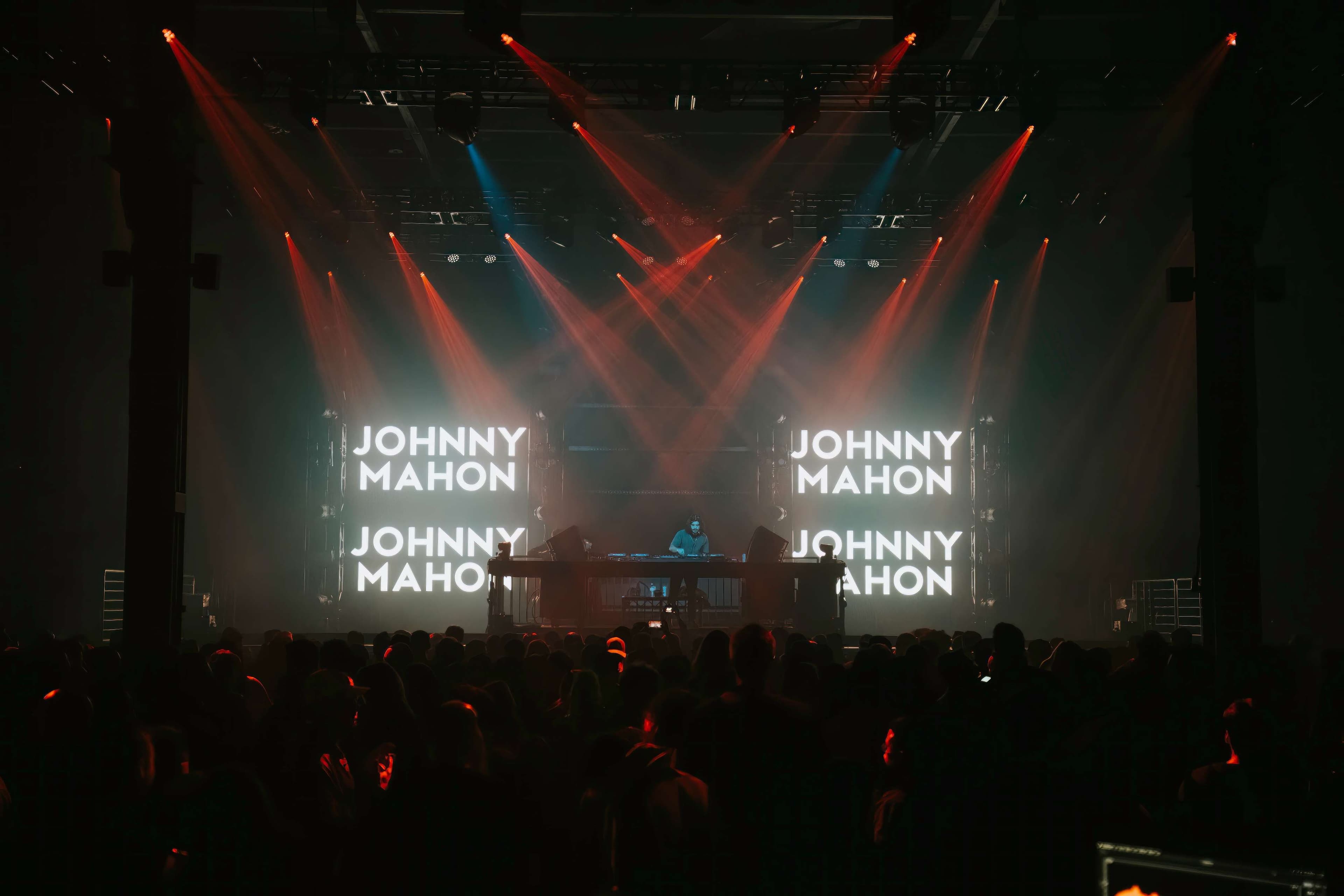dj johnny mason on stage at a concert